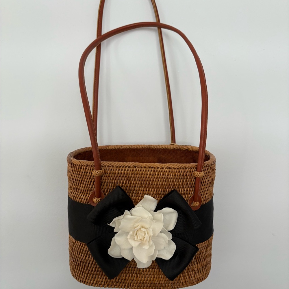 Elegant Brown Woven Shoulder Bag with Black and White Floral Accent